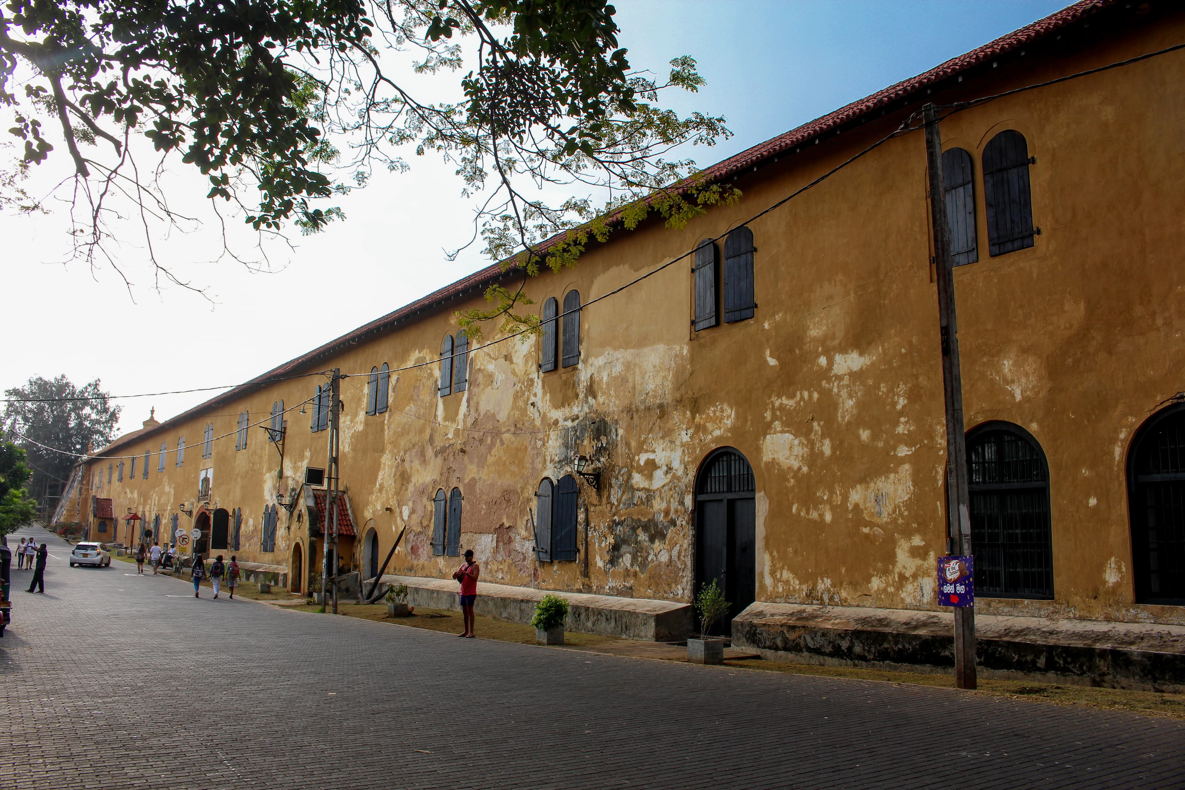 Travellers walking through the historic Galle Fort