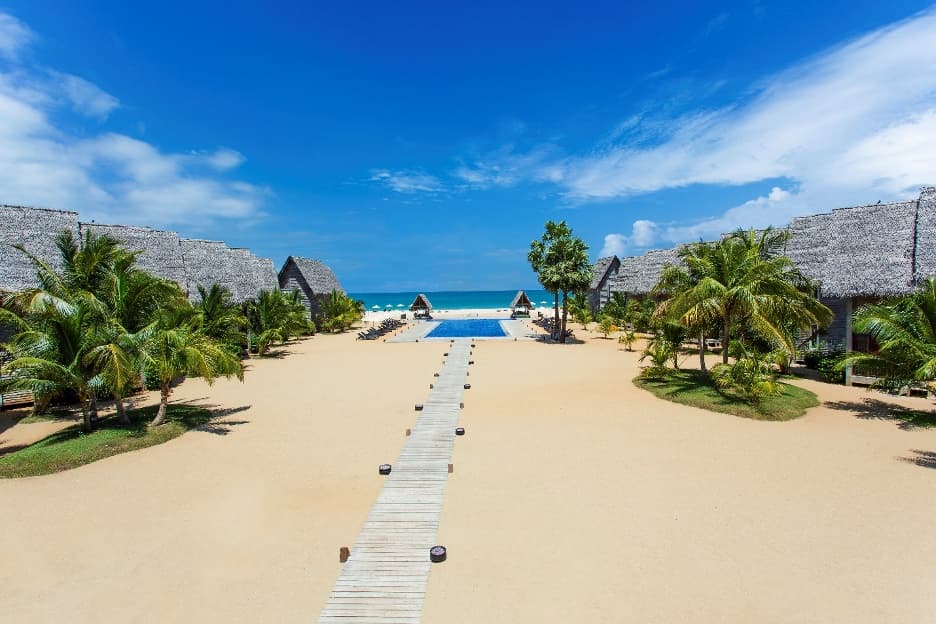 Beachfront resort with palm trees and a pool on Sri Lanka's east coast